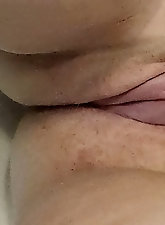 A plump woman is opening her legs