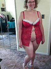 Aroused mature whore is spreading her lips